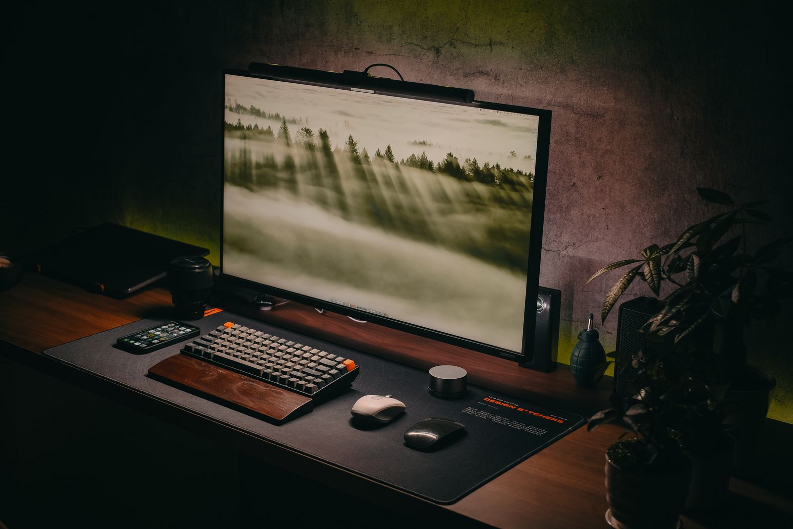 Low-light desk with a single lit monitor